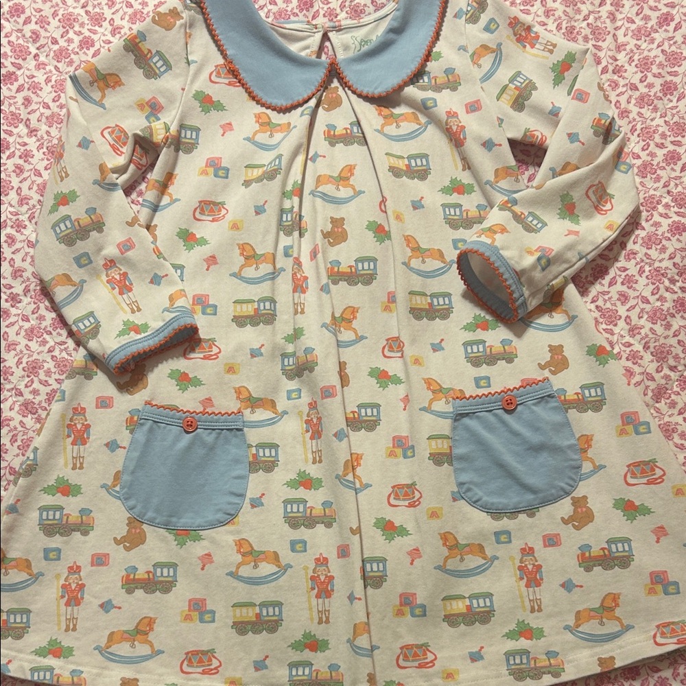 Adorable Christmas Toy Patterned Dress with Blue Accents